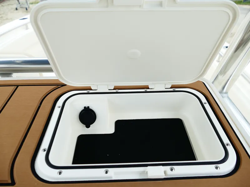 Slide: The Image of Open storage compartment on 2026 Bulls Bay 255CC boat. - 21