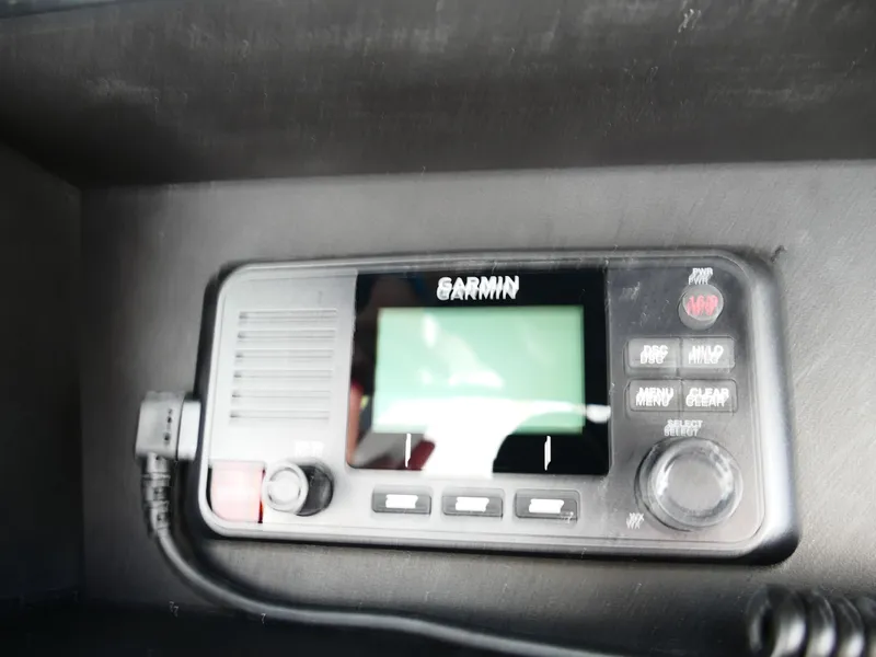 Slide: The Image of Garmin marine radio on Bulls Bay 255CC boat dashboard, 2026 model. - 30