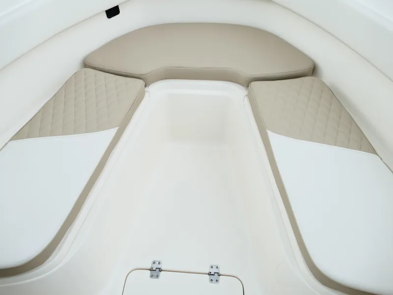 Slide: The Image of 2026 Bulls Bay 255CC boat interior with beige and white cushioned seating. - 38