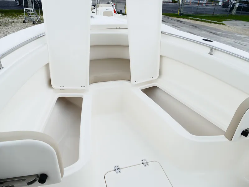 Slide: The Image of 2026 Bulls Bay 255CC boat interior with spacious seating and storage compartments. - 39