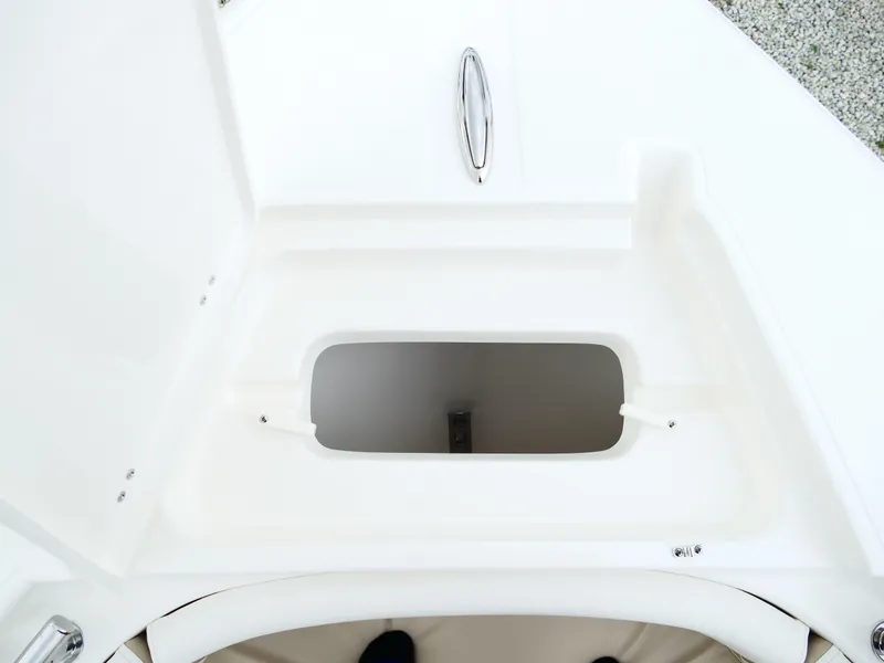 Slide: The Image of Open storage compartment on 2026 Bulls Bay 255CC boat, featuring sleek white interior design. - 43