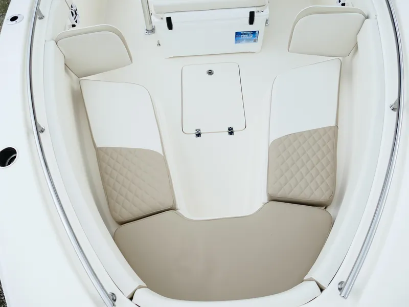 Slide: The Image of 2026 Bulls Bay 255CC boat interior with cushioned seating and storage compartment. - 47