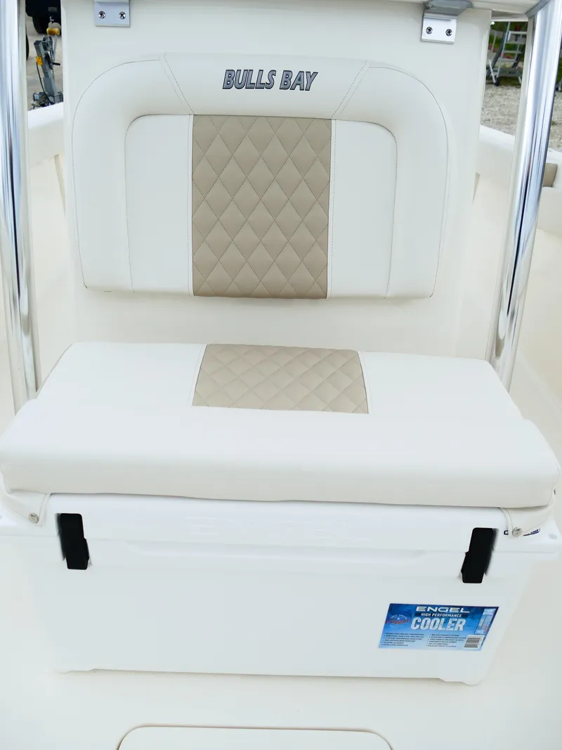 Slide: The Image of Bulls Bay 255CC 2026 boat seat with integrated Engel cooler, featuring beige and white upholstery. - 49