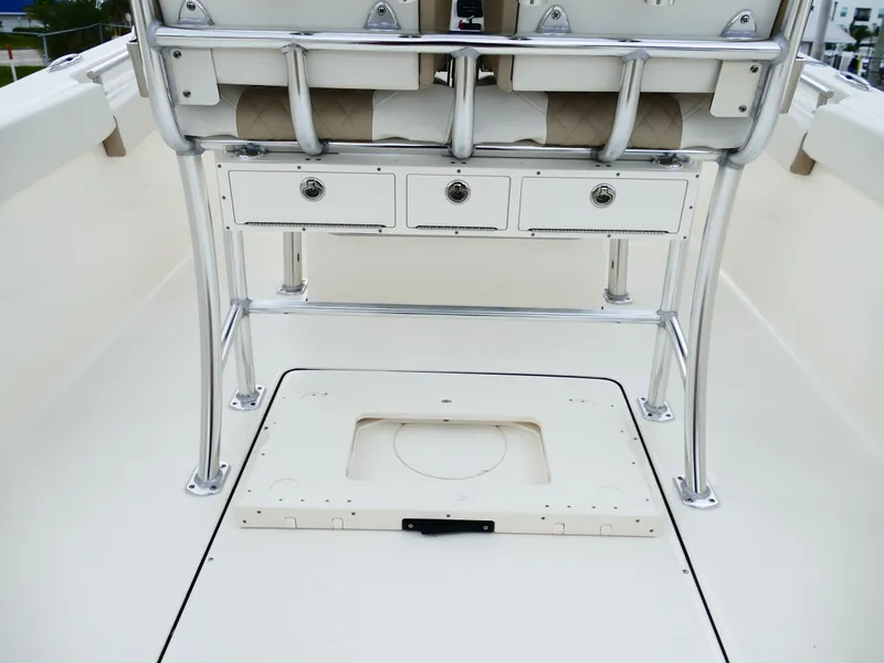 Slide: The Image of 2026 Bulls Bay 255CC boat interior with storage compartments and seating. - 8