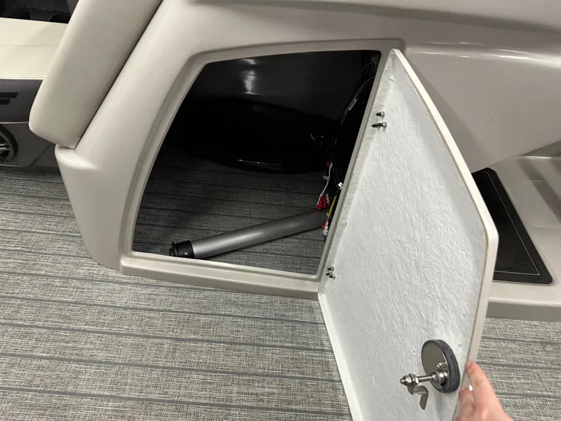 Slide: The Image of Open storage compartment in 2022 Starcraft SLS 3 boat interior. - 10