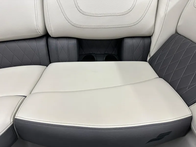 Slide: The Image of 2022 Starcraft SLS 3 boat seating with beige and gray upholstery, featuring quilted design. - 11