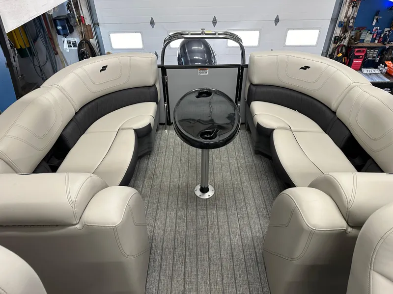 Slide: The Image of 2022 Starcraft SLS 3 boat interior with beige seating and central table. - 12