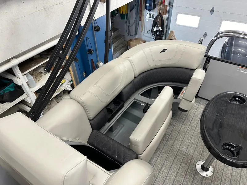 Slide: The Image of 2022 Starcraft SLS 3 boat interior with beige and black seating. - 13