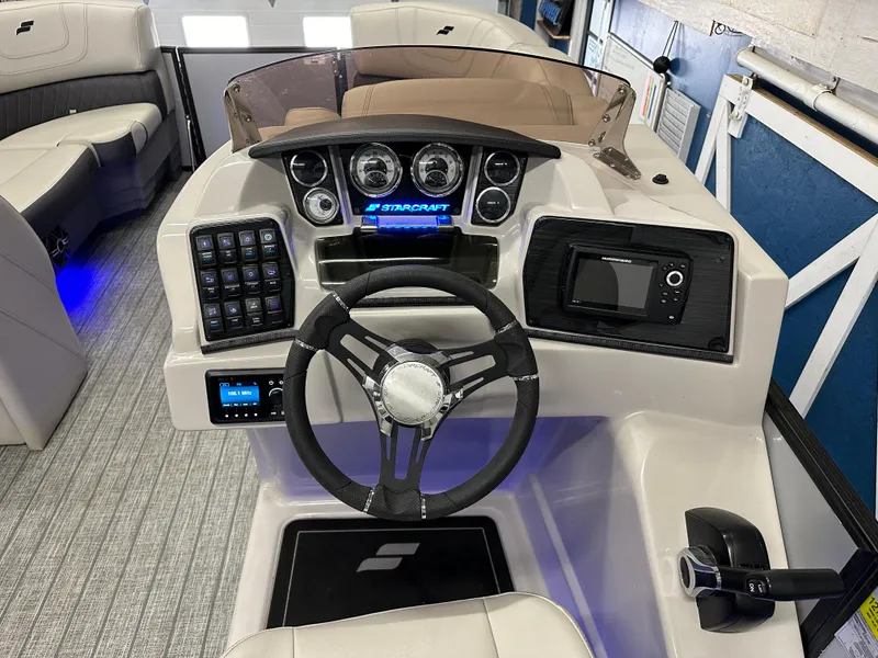 Slide: The Image of 2022 Starcraft SLS 3 boat dashboard with steering wheel and control panel. - 14