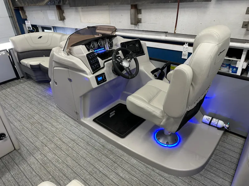 Slide: The Image of 2022 Starcraft SLS 3 boat interior with modern helm, plush seating, and ambient lighting. - 16