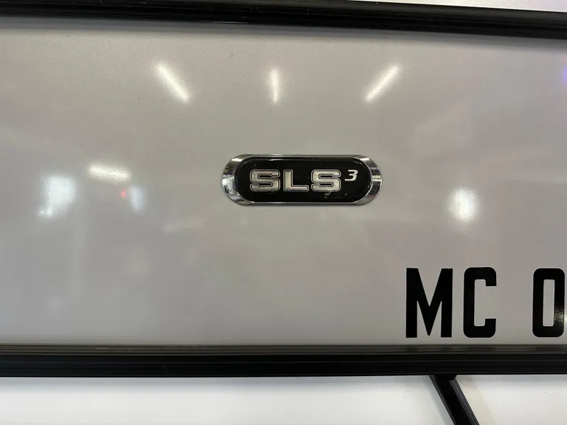 Slide: The Image of 2022 Starcraft SLS 3 emblem on a reflective surface. - 2