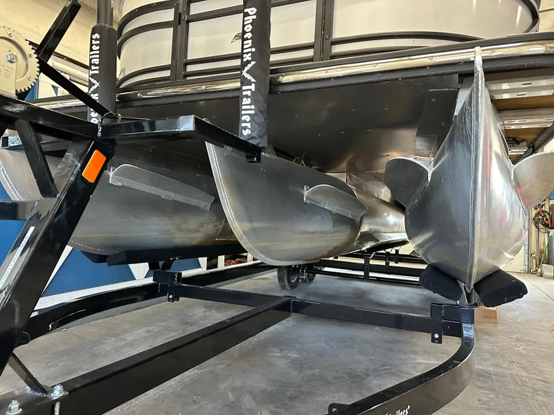 Slide: The Image of 2022 Starcraft SLS 3 pontoon boat on Phoenix trailer, showcasing aluminum pontoons. - 3
