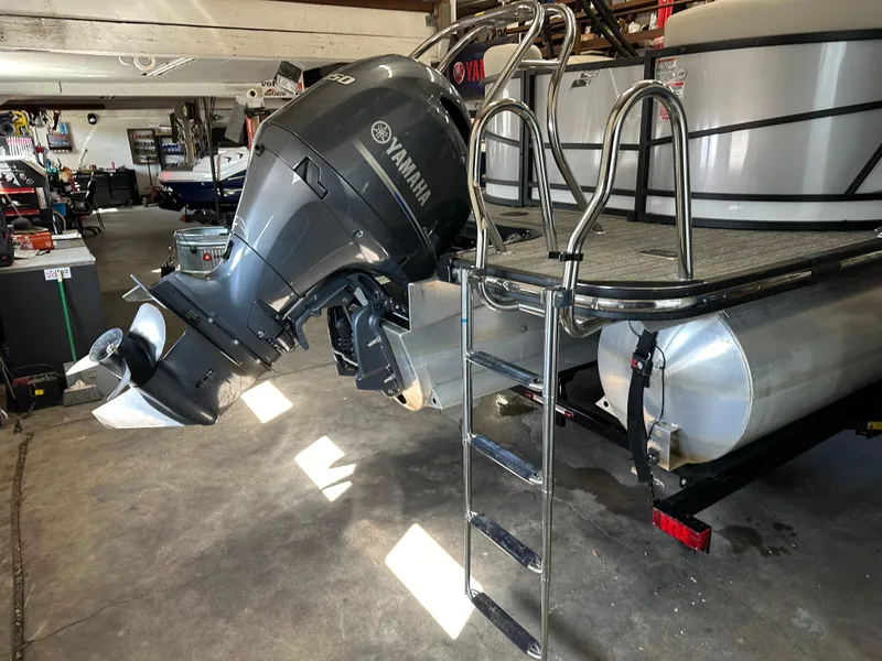 Slide: The Image of 2022 Starcraft SLS 3 boat with Yamaha outboard motor in a garage. - 4