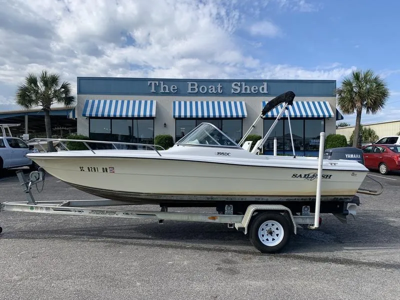 Slide: The Image of 2005 Sailfish 198 DC boat on trailer outside The Boat Shed dealership. - 1