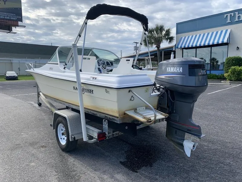 Slide: The Image of 2005 Sailfish 198 DC boat on trailer with Yamaha 115 outboard motor. - 2