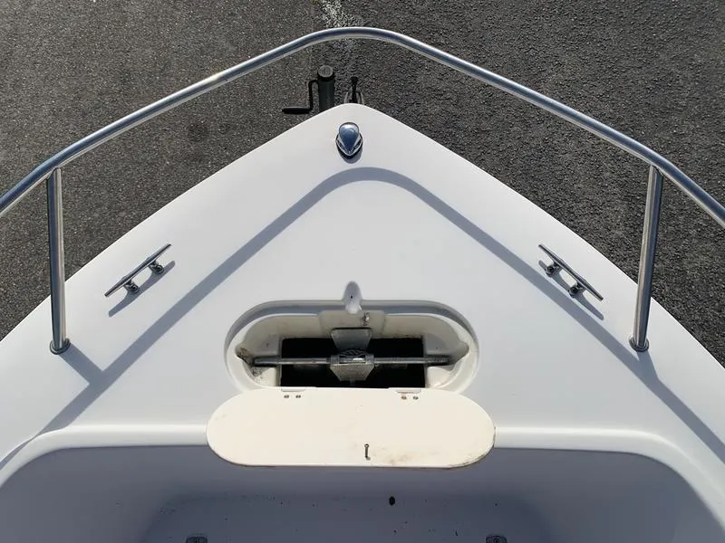 Slide: The Image of Bow of 2005 Sailfish 198 DC boat with anchor storage and railing. - 22