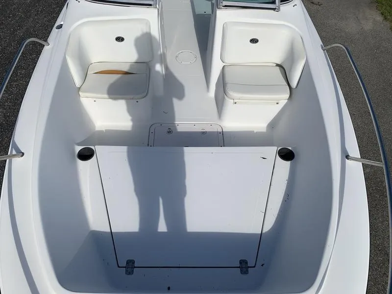 Slide: The Image of 2005 Sailfish 198 DC boat interior with seating and storage compartments. - 24