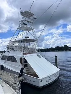 Slide: The Image of 1986 Egg Harbor 60 Sportfisherman yacht docked under cloudy sky. - 2