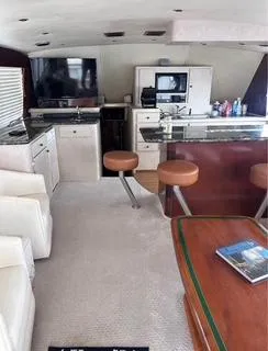 Slide: The Image of Interior of 1986 Egg Harbor 60 Sportfisherman yacht with modern kitchen and seating area. - 11
