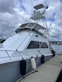 Slide: The Image of 1986 Egg Harbor 60 Sportfisherman docked under cloudy skies. - 4