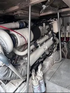 Slide: The Image of Engine room of 1986 Egg Harbor 60 Sportfisherman, showcasing complex machinery and components. - 8