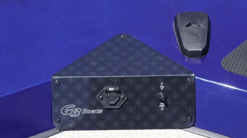 Slide: The Image of 2025 G3 Sportsman 1710 boat dashboard with control panel and logo. - 11