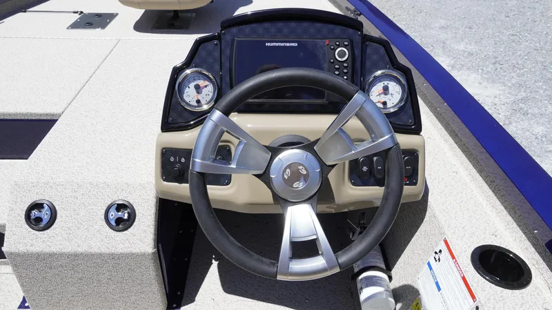 Slide: The Image of 2025 G3 Sportsman 1710 boat dashboard with steering wheel and gauges. - 14