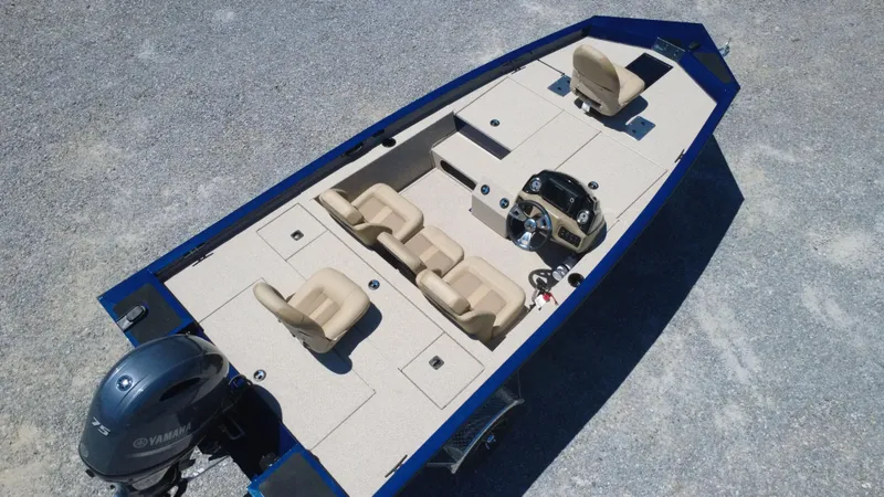 Slide: The Image of 2025 G3 Sportsman 1710 boat with Yamaha motor, beige seating, and spacious deck layout. - 16