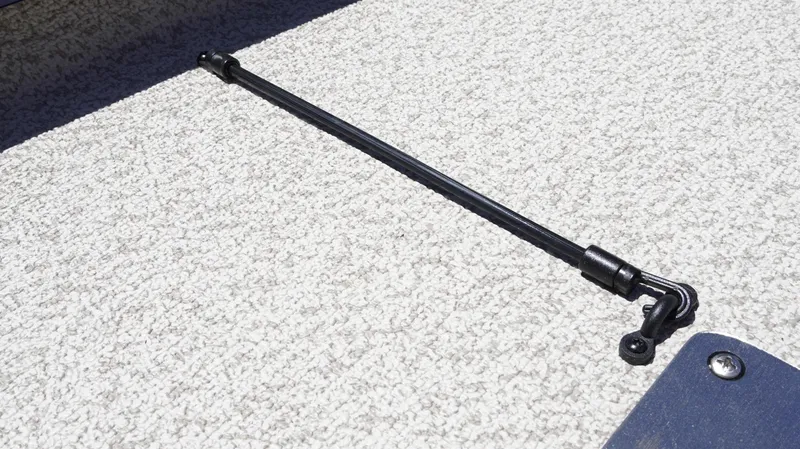 Slide: The Image of Gas strut on G3 Sportsman 1710 boat, 2025 model, resting on carpeted surface. - 22