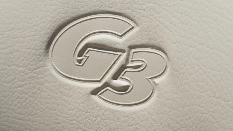 Slide: The Image of Embossed G3 logo on textured surface, 2025 Sportsman 1710 model. - 24