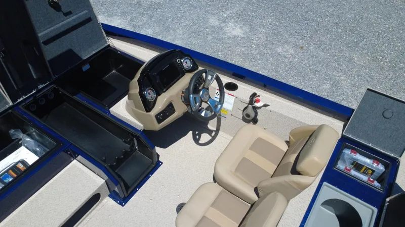Slide: The Image of 2025 G3 Sportsman 1710 boat interior with steering console and seating. - 27