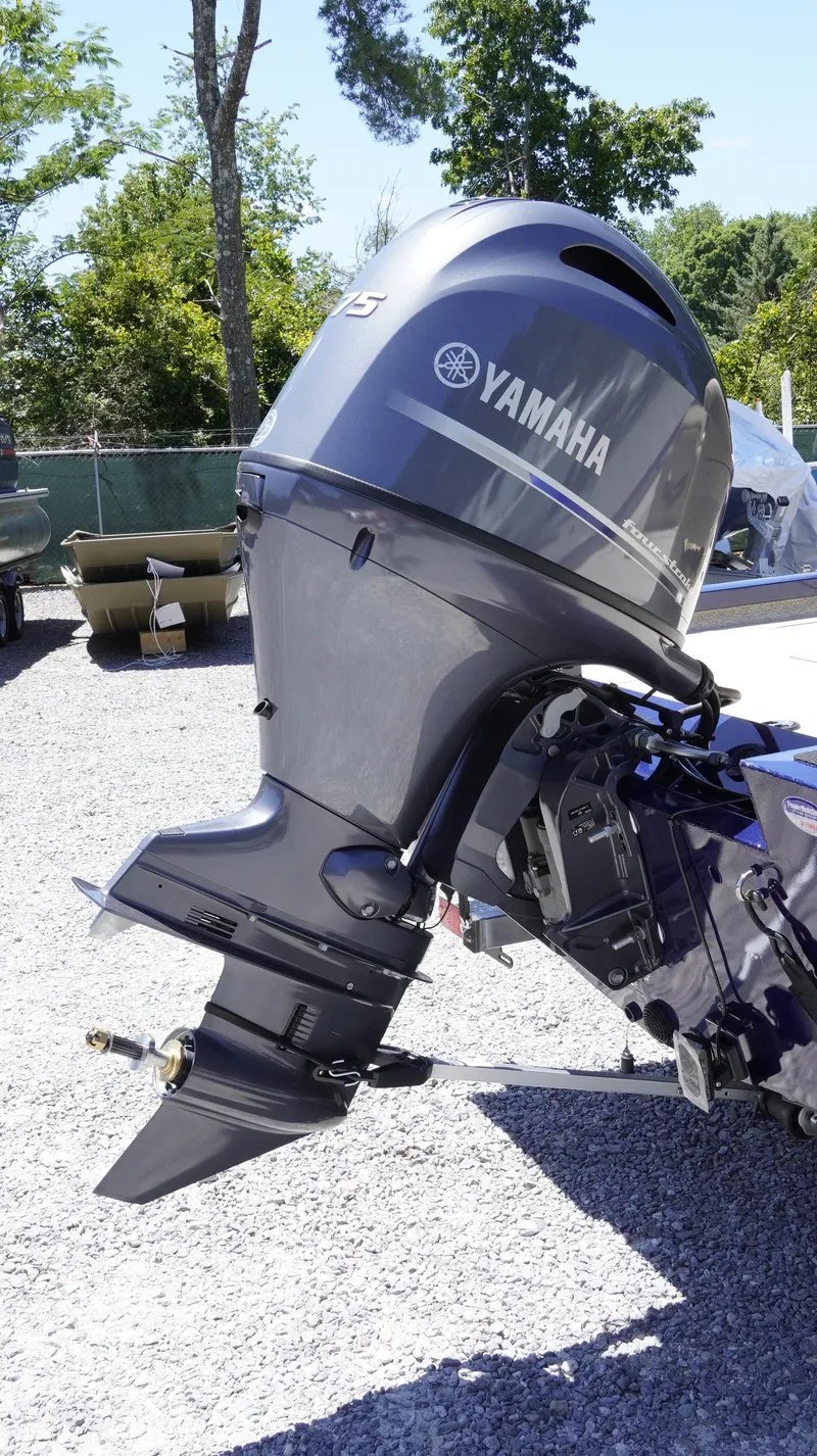 Slide: The Image of 2025 G3 Sportsman 1710 with Yamaha outboard motor in a sunny outdoor setting. - 28