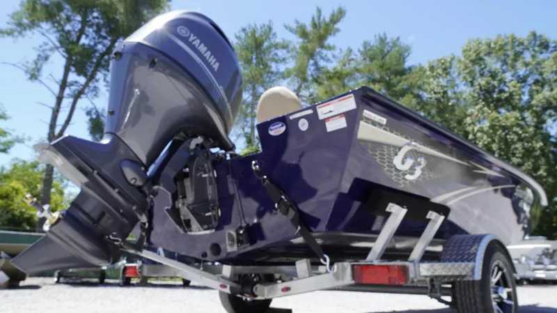 Slide: The Image of 2025 G3 Sportsman 1710 boat with Yamaha motor on trailer, outdoors. - 29