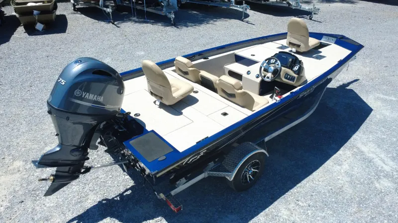 Slide: The Image of 2025 G3 Sportsman 1710 boat with Yamaha engine, beige seating, and trailer. - 3