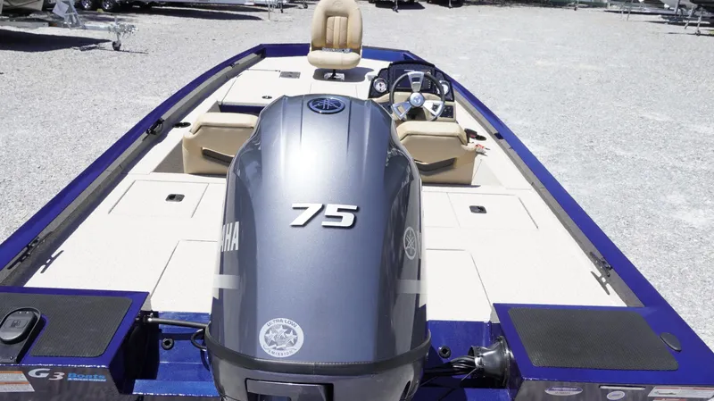 Slide: The Image of 2025 G3 Sportsman 1710 boat with Yamaha 75 engine, beige seating, and steering console. - 30