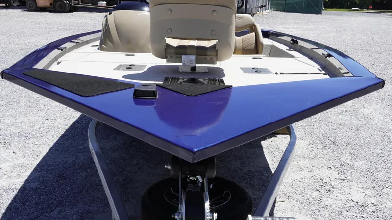 Slide: The Image of 2025 G3 Sportsman 1710 boat, blue hull, parked on gravel. - 33