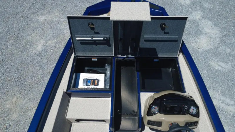 Slide: The Image of 2025 G3 Sportsman 1710 boat interior with storage compartments and steering console. - 41