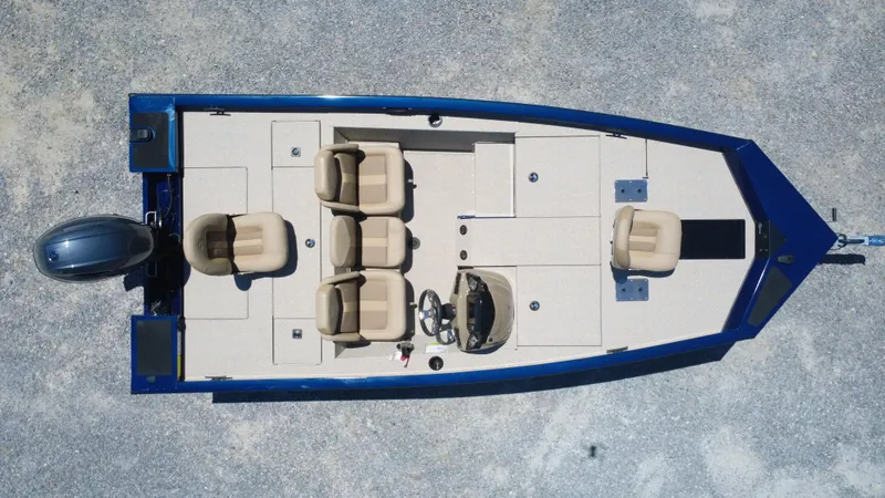 Slide: The Image of 2025 G3 Sportsman 1710 boat, aerial view, blue exterior, beige seating, outboard motor. - 5