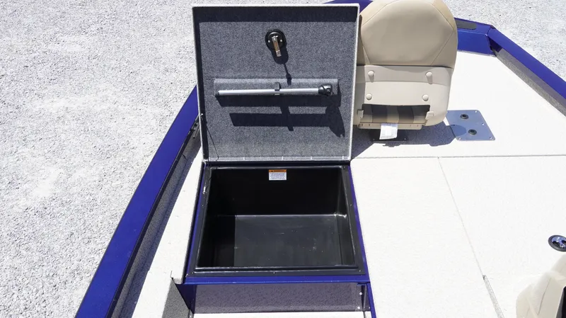 Slide: The Image of Open storage compartment on 2025 G3 Sportsman 1710 boat deck. - 8