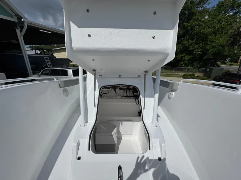 Slide: The Image of 2025 Cape Horn 22 OS boat interior with open storage compartment, showcasing sleek design. - 24