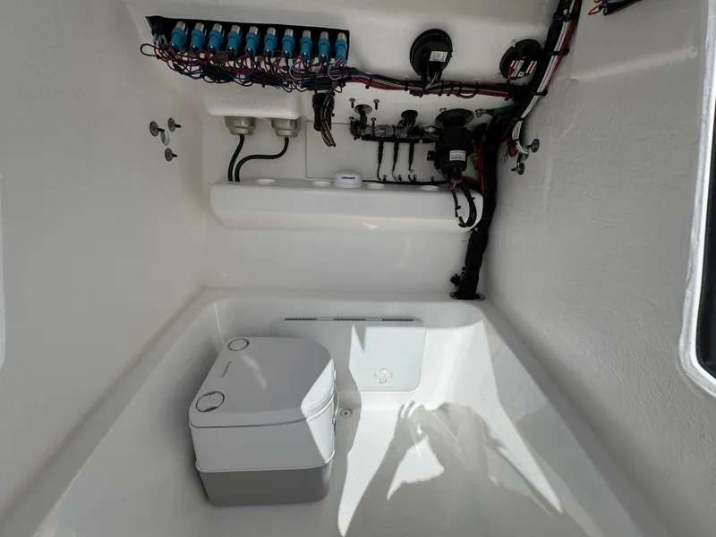 Slide: The Image of 2025 Cape Horn 22 OS boat interior with wiring and portable toilet. - 25