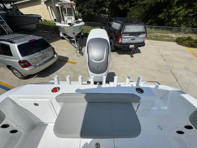 Slide: The Image of 2025 Cape Horn 22 OS boat with outboard motor in a parking lot. - 40