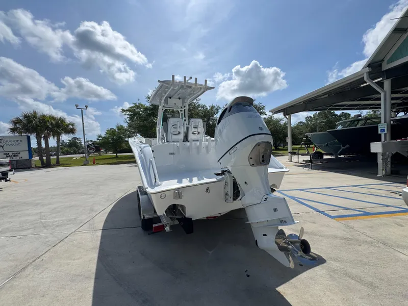 Slide: The Image of 2025 Cape Horn 22 OS boat on trailer under sunny sky. - 15