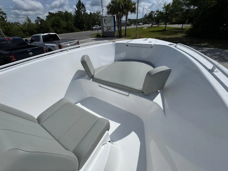 Slide: The Image of 2025 Cape Horn 22 OS boat interior with gray seating and white deck. - 18