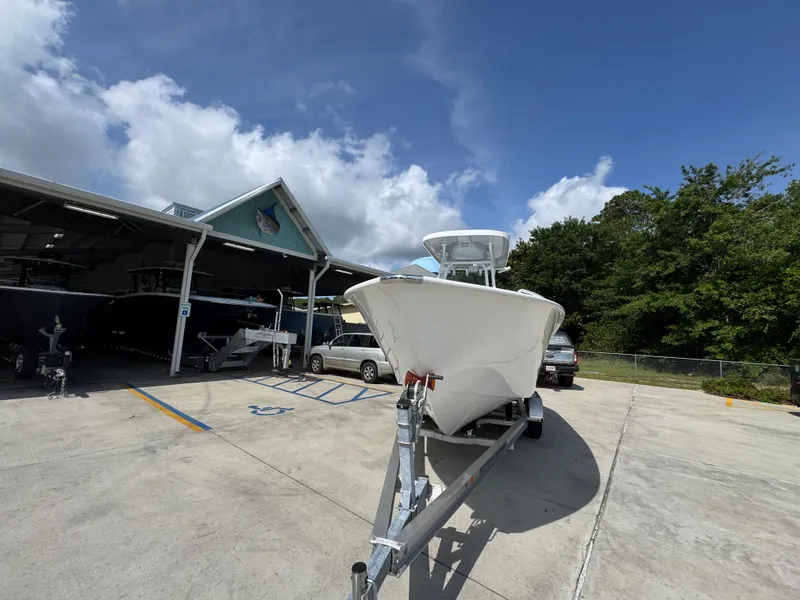 Slide: The Image of 2025 Cape Horn 22 OS boat on trailer in sunny outdoor setting. - 5