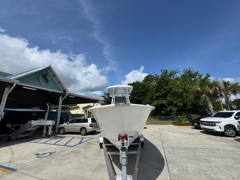 Slide: The Image of 2025 Cape Horn 22 OS boat on trailer in sunny outdoor setting. - 6