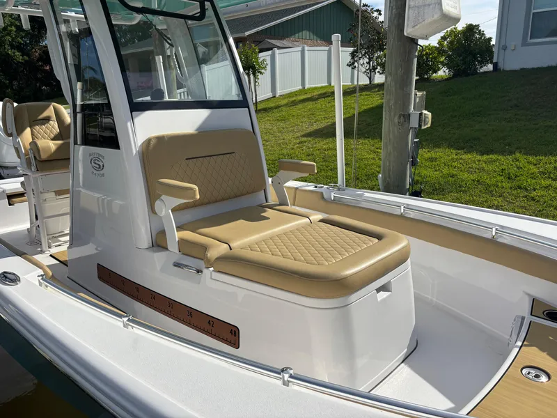 Slide: The Image of 2024 Sportsman Masters 247OE Bay Boat with tan seating and sleek design. - 2