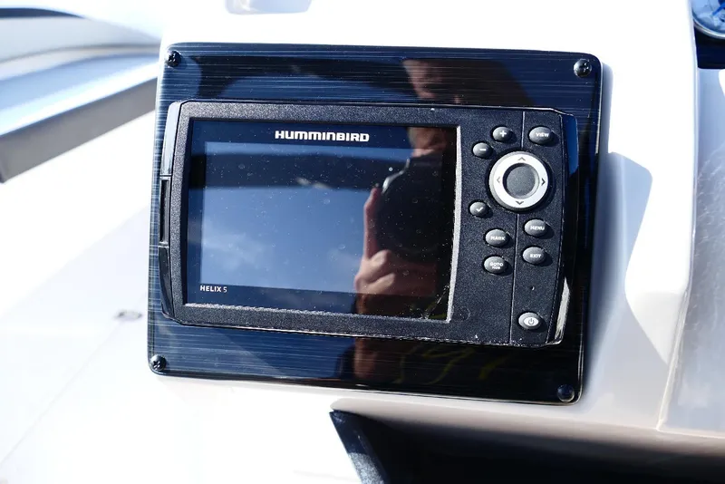 Slide: The Image of Humminbird Helix 5 fish finder on 2026 Starcraft SVX 211 OB boat dashboard. - 16