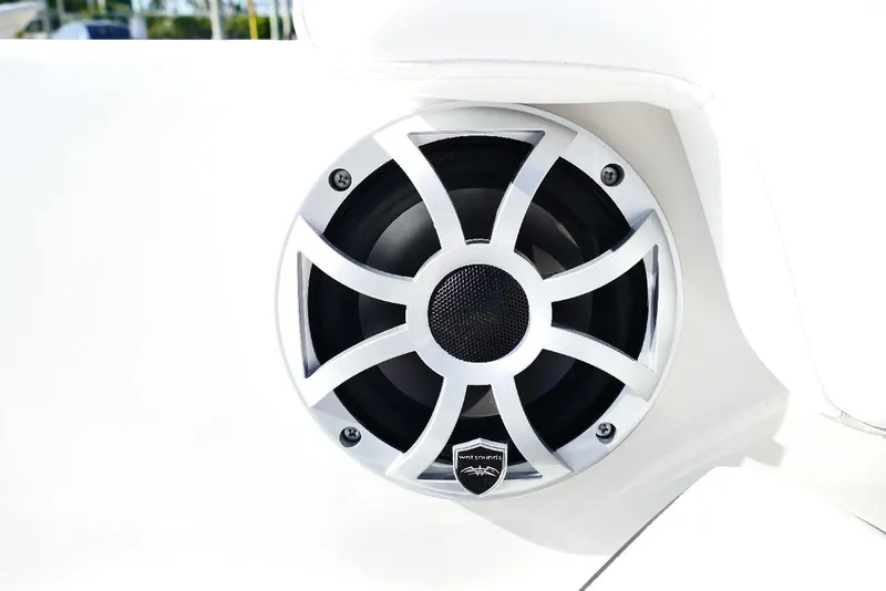 Slide: The Image of Speaker on 2026 Starcraft SVX 211 OB boat, featuring sleek white design. - 20