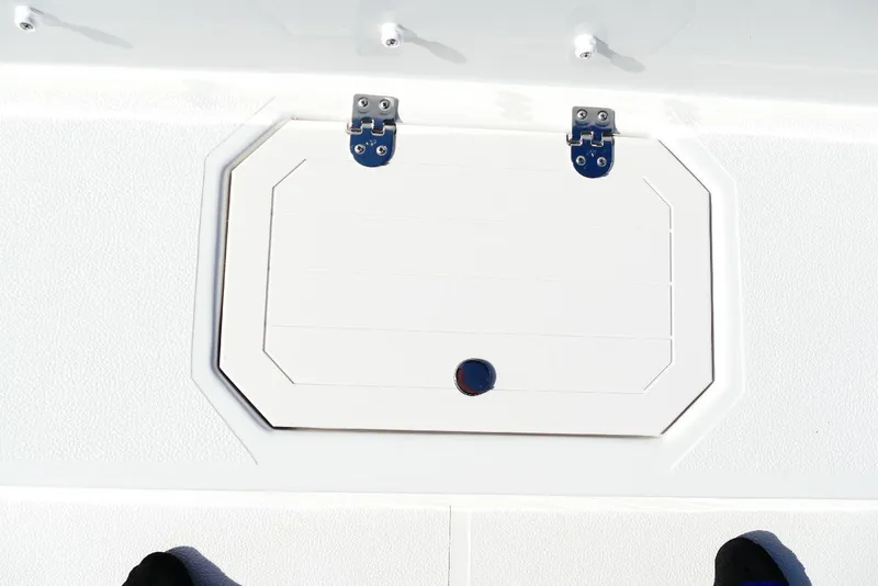 Slide: The Image of Hatch on 2026 Starcraft SVX 211 OB boat deck, featuring secure hinges. - 25